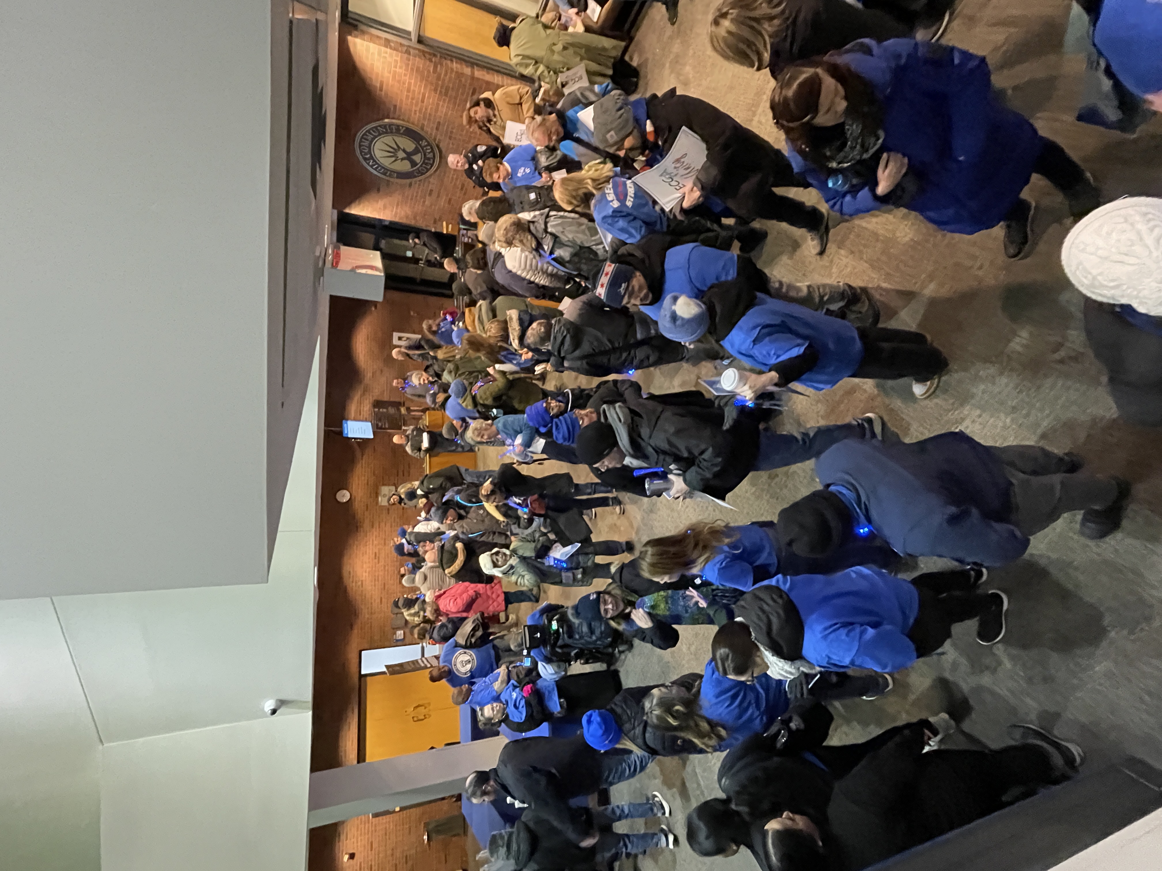ECCFA members prepare to enter a Board of Trustees meeting January 2026