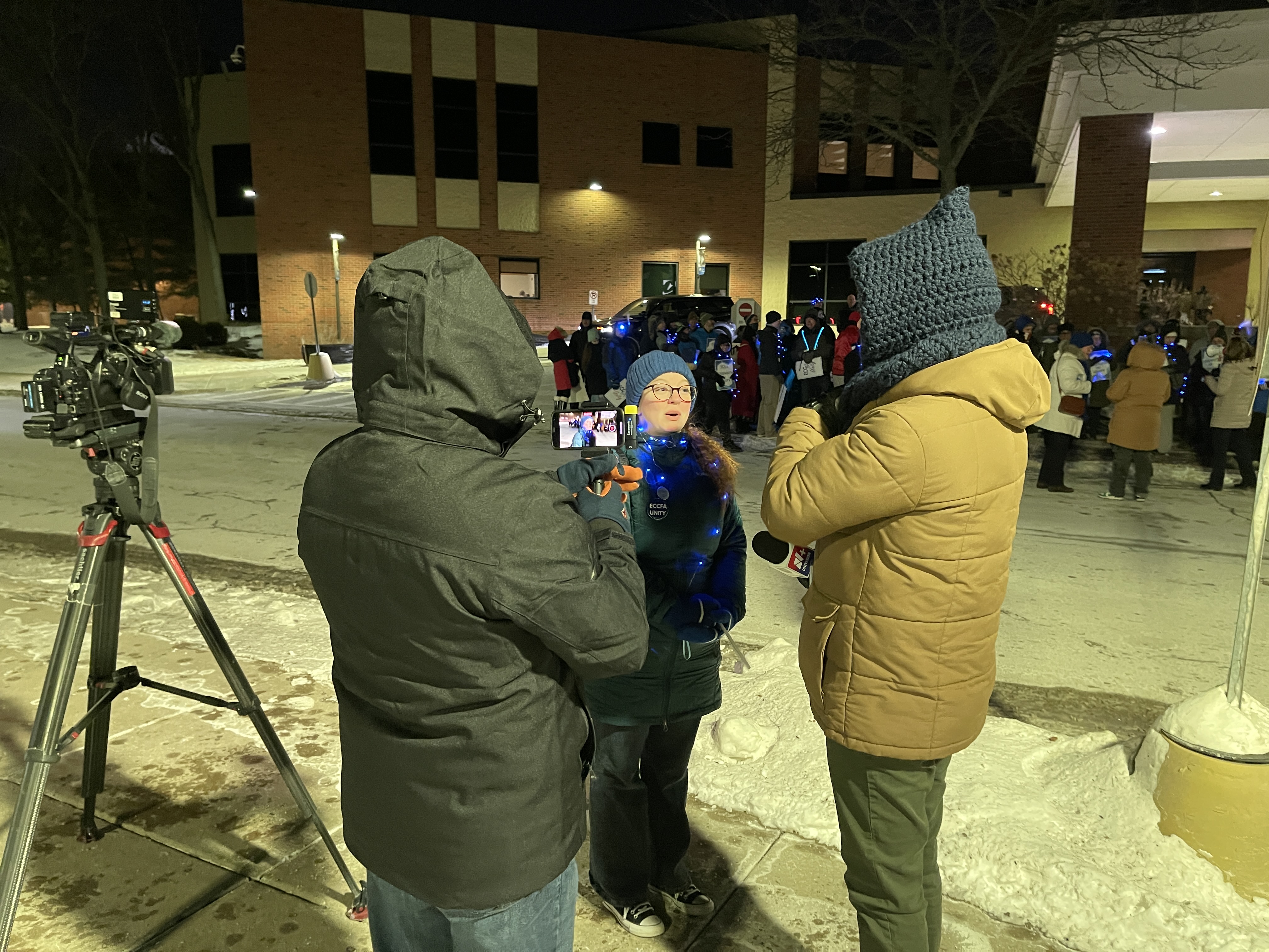 Adjunct Librarian Lauren Sullivan is interviewed by Univision during informational picketing January 2026